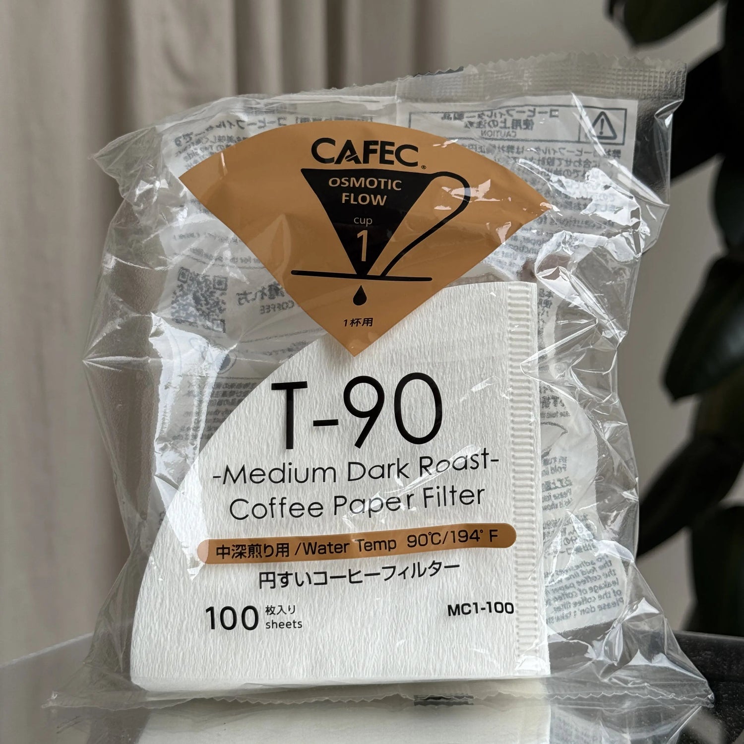 Cafec T-90 coffee paper filter packaging with clear plastic wrapping.