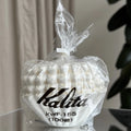 Bag of Kalita coffee filters with visible branding on a neutral background